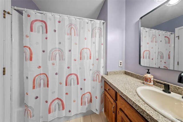 8206 Saint James Ct, Grosse Ile, MI 48138 - full bathroom with vanity, a shower with shower curtain, and lofted ceiling