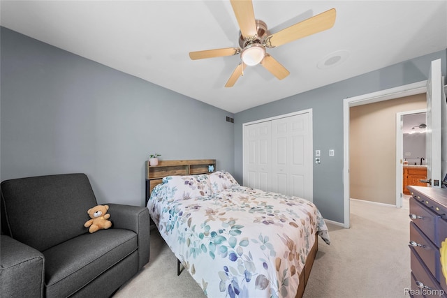 8206 Saint James Ct, Grosse Ile, MI 48138 - bedroom featuring light carpet, a closet, and a ceiling fan