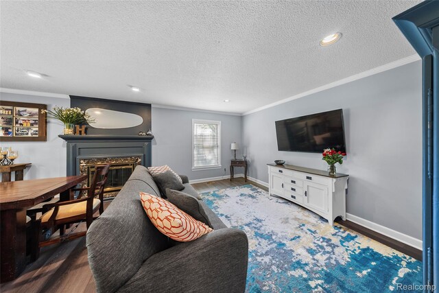 8206 Saint James Ct, Grosse Ile, MI 48138 - living area featuring a textured ceiling, ornamental molding, a high end fireplace, wood finished floors, and recessed lighting