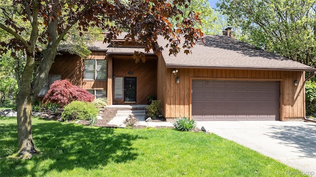 8206 Saint James Ct, Grosse Ile, MI 48138 - view of front of home featuring a garage, driveway, a front yard, a chimney, and a shingled roof
