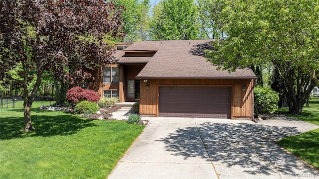 8206 Saint James Ct, Grosse Ile, MI 48138 - view of front of house with a shingled roof, concrete driveway, a garage, and a front lawn
