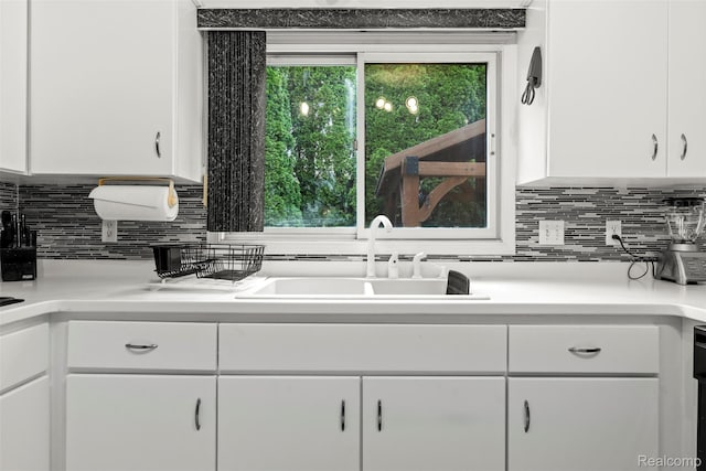 2896 Chippewa Ct, Troy, MI 48085 - kitchen featuring white cabinets, backsplash, and light countertops
