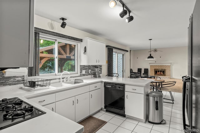 2896 Chippewa Ct, Troy, MI 48085 - kitchen featuring black appliances, a peninsula, and light countertops