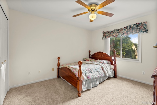 2896 Chippewa Ct, Troy, MI 48085 - bedroom with light carpet, ceiling fan, and a closet