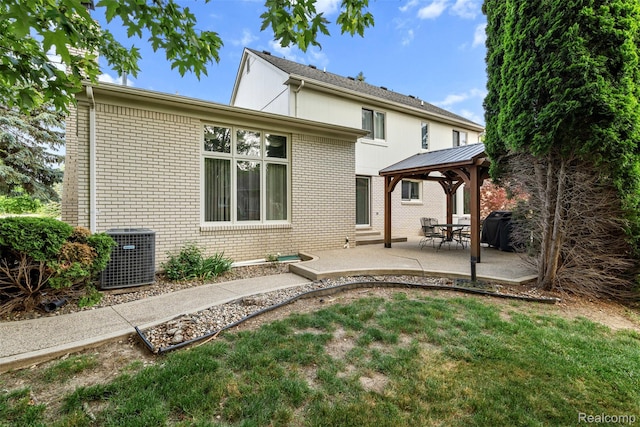 2896 Chippewa Ct, Troy, MI 48085 - back of house with brick siding, a gazebo, a patio area, and a lawn