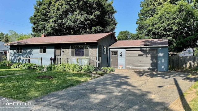 713 Wiltshire Dr, Owosso, MI 48867 - single story home with an attached garage and driveway