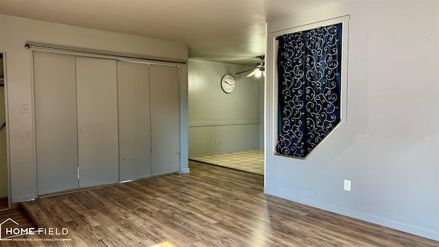713 Wiltshire Dr, Owosso, MI 48867 - unfurnished bedroom featuring wood finished floors