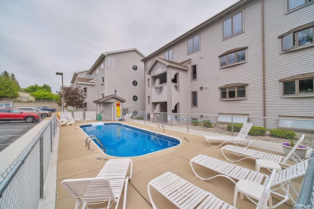 317 5th Ave Unit 8, Manistee, MI 49660 - community pool with a patio area