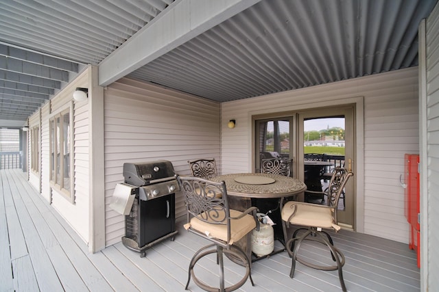 317 5th Ave Unit 8, Manistee, MI 49660 - wooden terrace featuring area for grilling and outdoor dining area
