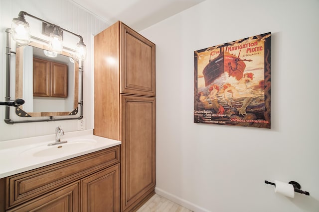317 5th Ave Unit 8, Manistee, MI 49660 - bathroom with vanity and baseboards