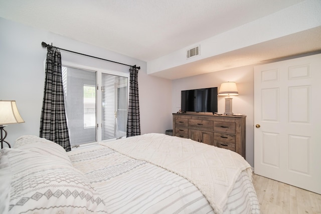 317 5th Ave Unit 8, Manistee, MI 49660 - bedroom featuring wood finished floors