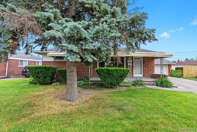 24845 Petersburg Ave, Eastpointe, MI 48021 - view of front of home featuring concrete driveway, brick siding, and an attached garage