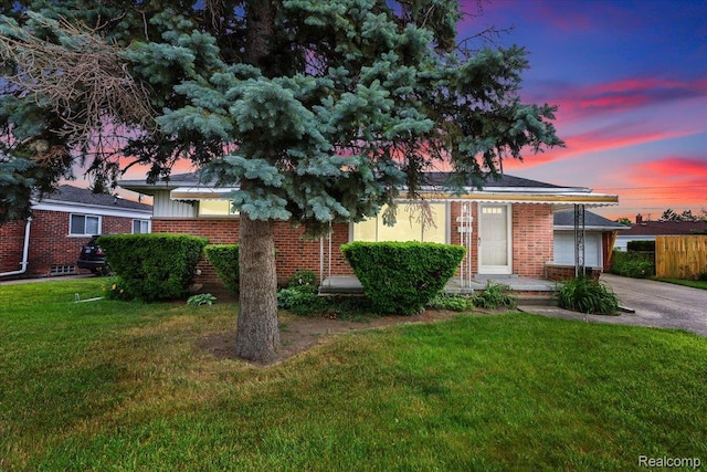 24845 Petersburg Ave, Eastpointe, MI 48021 - view of front of property featuring driveway, brick siding, and a garage