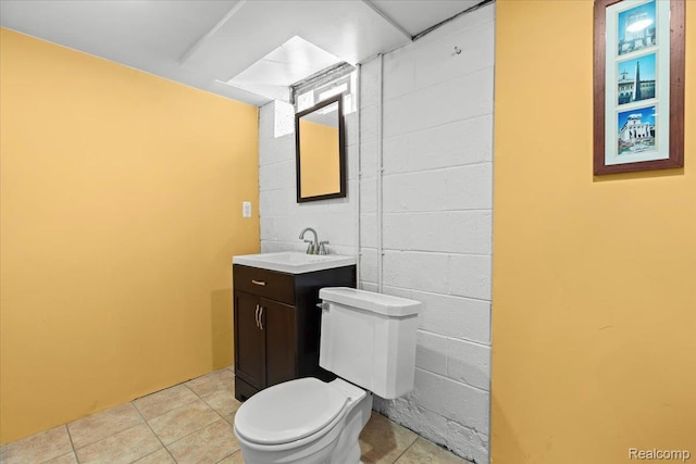 24845 Petersburg Ave, Eastpointe, MI 48021 - bathroom featuring vanity, tile patterned flooring, and concrete block wall