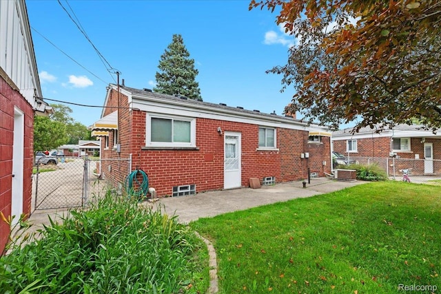 24845 Petersburg Ave, Eastpointe, MI 48021 - rear view of property featuring brick siding, a fenced backyard, a patio area, and a gate