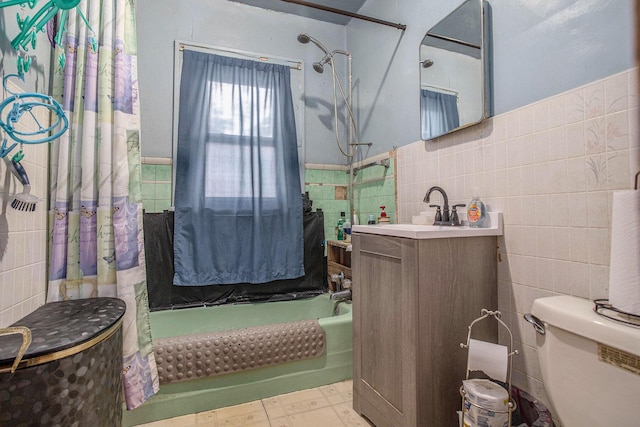 52 Roseneath Ave, Battle Creek, MI 49037 - full bath featuring tile walls, shower / bath combo with shower curtain, vanity, and a wainscoted wall