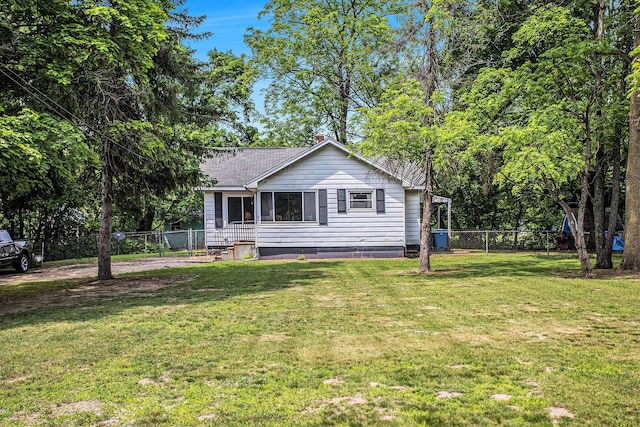 52 Roseneath Ave, Battle Creek, MI 49037 - view of front of home with a shingled roof and a chimney