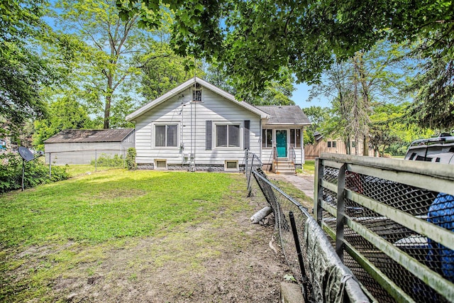 52 Roseneath Ave, Battle Creek, MI 49037 - back of house with entry steps and a fenced backyard