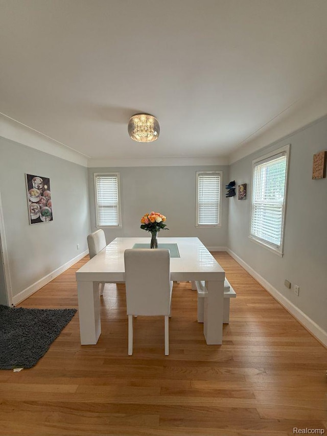 2130 Geneva St, Dearborn, MI 48124 - dining space featuring light wood-type flooring and ornamental molding