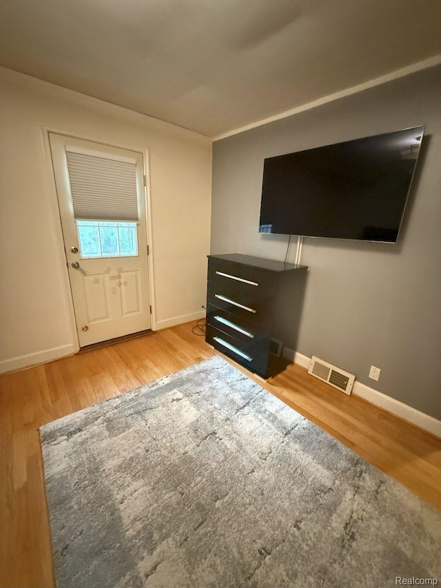 2130 Geneva St, Dearborn, MI 48124 - unfurnished living room featuring wood finished floors and baseboards