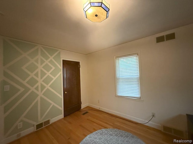 2130 Geneva St, Dearborn, MI 48124 - unfurnished bedroom featuring wood finished floors
