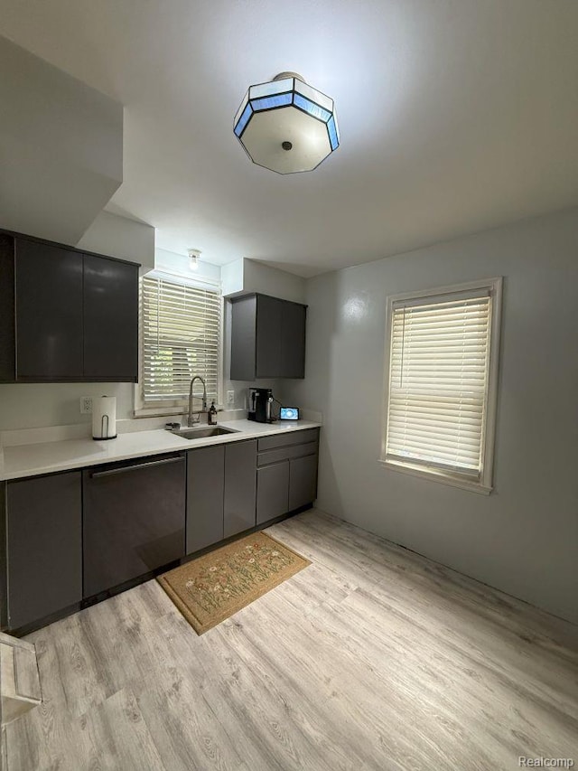 2130 Geneva St, Dearborn, MI 48124 - kitchen featuring dishwasher, light countertops, light wood-style floors, modern cabinets, and gray cabinetry
