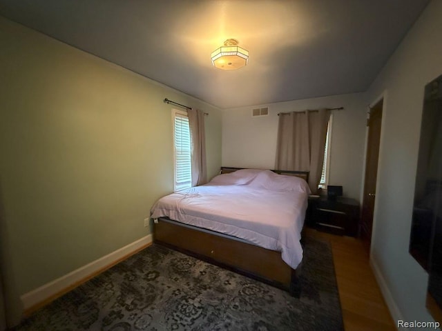2130 Geneva St, Dearborn, MI 48124 - bedroom with baseboards and wood finished floors