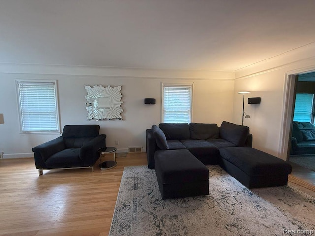 2130 Geneva St, Dearborn, MI 48124 - living area featuring light wood-style floors and crown molding