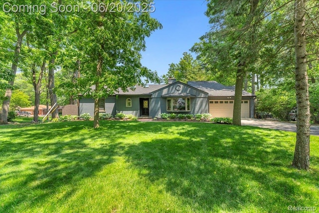 21089 Thorofare Rd, Grosse Ile, MI 48138 - view of front of property featuring driveway, an attached garage, and a front lawn