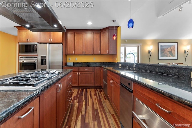 21089 Thorofare Rd, Grosse Ile, MI 48138 - kitchen with range hood, appliances with stainless steel finishes, dark wood-style floors, decorative light fixtures, and dark stone countertops