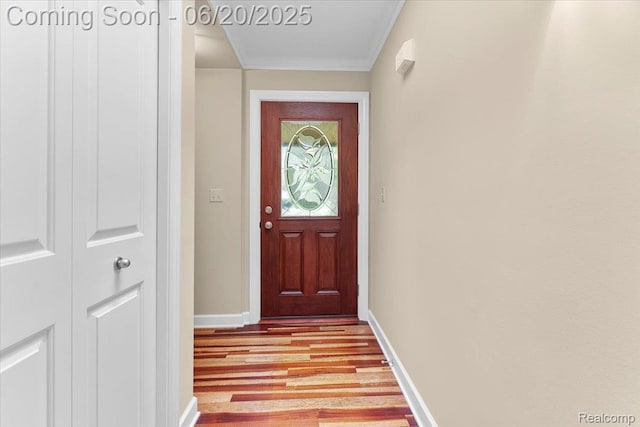21089 Thorofare Rd, Grosse Ile, MI 48138 - doorway featuring light wood-type flooring and crown molding