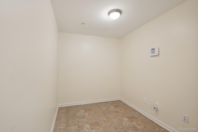 3207 Camden Dr Unit 110, Troy, MI 48084 - empty room with baseboards and stone finish flooring