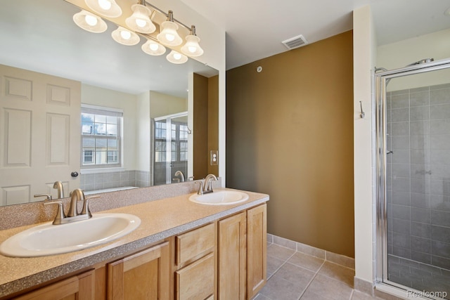 3207 Camden Dr Unit 110, Troy, MI 48084 - bathroom with a shower stall, double vanity, and tile patterned flooring