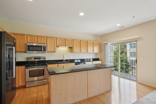 3207 Camden Dr Unit 110, Troy, MI 48084 - kitchen featuring appliances with stainless steel finishes, light wood-style flooring, light brown cabinetry, dark countertops, and recessed lighting