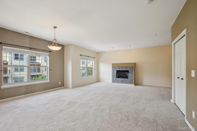 3207 Camden Dr Unit 110, Troy, MI 48084 - unfurnished living room with carpet floors and a tiled fireplace