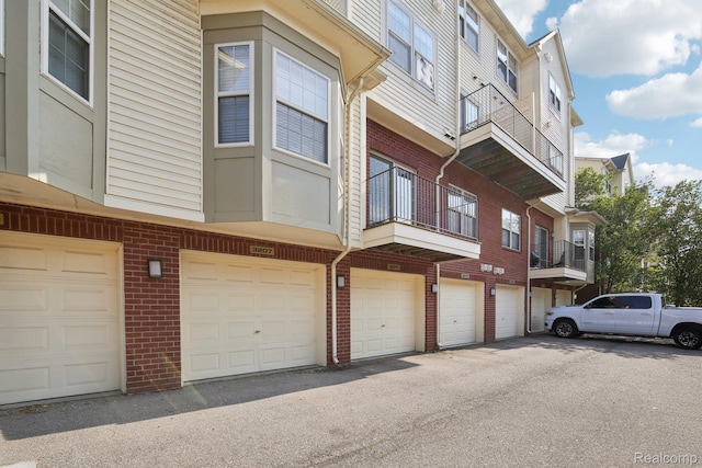 3207 Camden Dr Unit 110, Troy, MI 48084 - view of building exterior featuring a garage