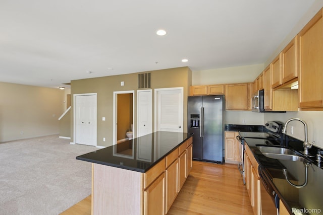 3207 Camden Dr Unit 110, Troy, MI 48084 - kitchen with appliances with stainless steel finishes, dark countertops, a kitchen island, open floor plan, and recessed lighting