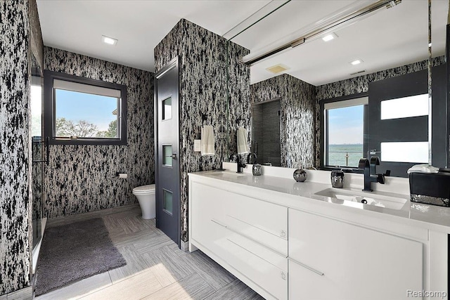 8349 Dixie Hwy, Ira, MI 48023 - bathroom featuring toilet and double vanity