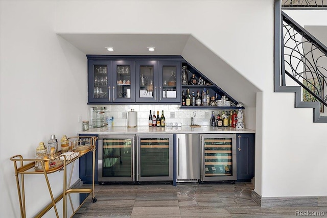 8349 Dixie Hwy, Ira, MI 48023 - indoor dry bar with beverage cooler, decorative backsplash, and stairway