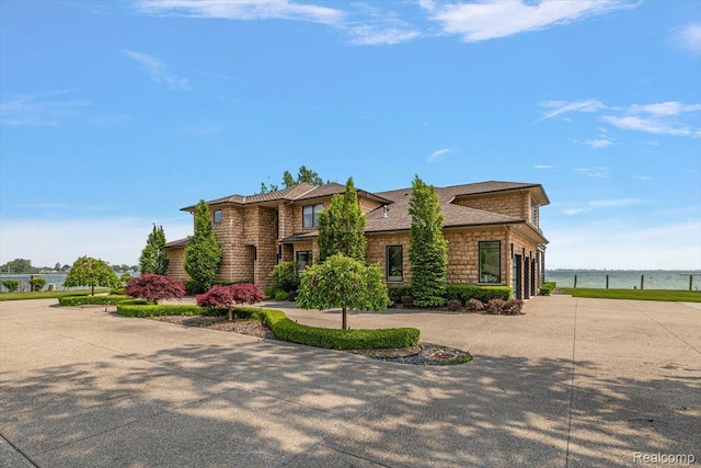 8349 Dixie Hwy, Ira, MI 48023 - view of front of property featuring driveway, a water view, and stone siding
