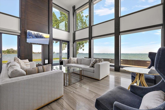 8349 Dixie Hwy, Ira, MI 48023 - living room featuring a towering ceiling, healthy amount of natural light, french doors, and light wood finished floors