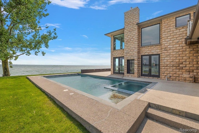 8349 Dixie Hwy, Ira, MI 48023 - view of swimming pool with a water view, a patio area, french doors, a pool with connected hot tub, and a yard