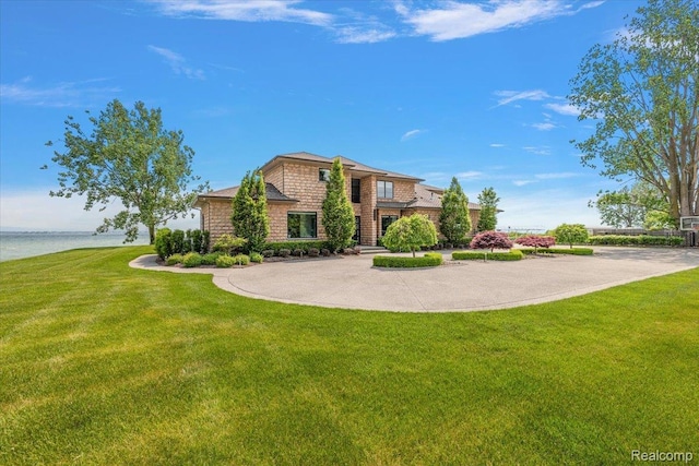 8349 Dixie Hwy, Ira, MI 48023 - view of front facade with a front lawn and a water view