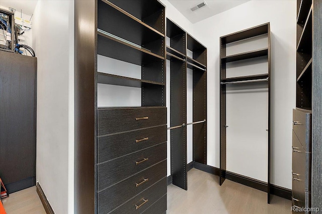8349 Dixie Hwy, Ira, MI 48023 - spacious closet featuring light wood-style flooring