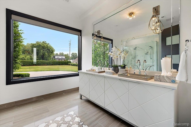 8349 Dixie Hwy, Ira, MI 48023 - bathroom with double vanity, a marble finish shower, and plenty of natural light