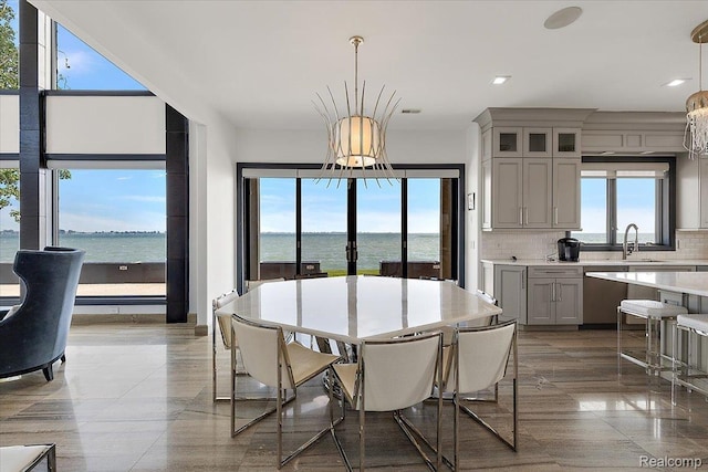 8349 Dixie Hwy, Ira, MI 48023 - dining room with a chandelier, recessed lighting, and a water view