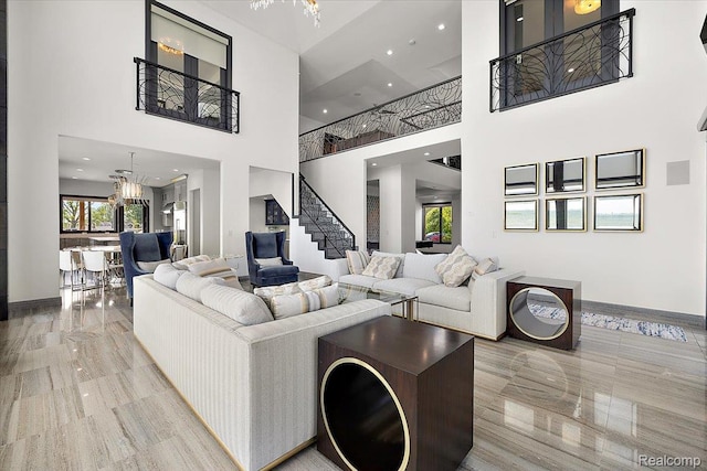 8349 Dixie Hwy, Ira, MI 48023 - living room featuring a high ceiling, stairway, recessed lighting, and a chandelier