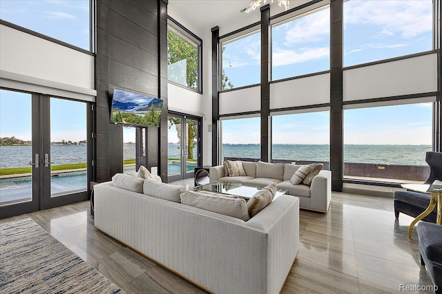 8349 Dixie Hwy, Ira, MI 48023 - living room with french doors, a towering ceiling, and wood finished floors