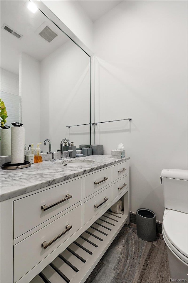8349 Dixie Hwy, Ira, MI 48023 - bathroom featuring vanity and wood finished floors