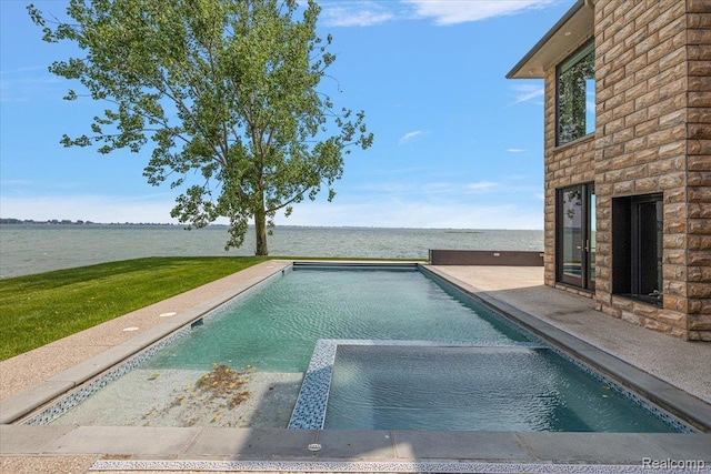 8349 Dixie Hwy, Ira, MI 48023 - view of swimming pool featuring a water view, a pool with connected hot tub, and a patio area